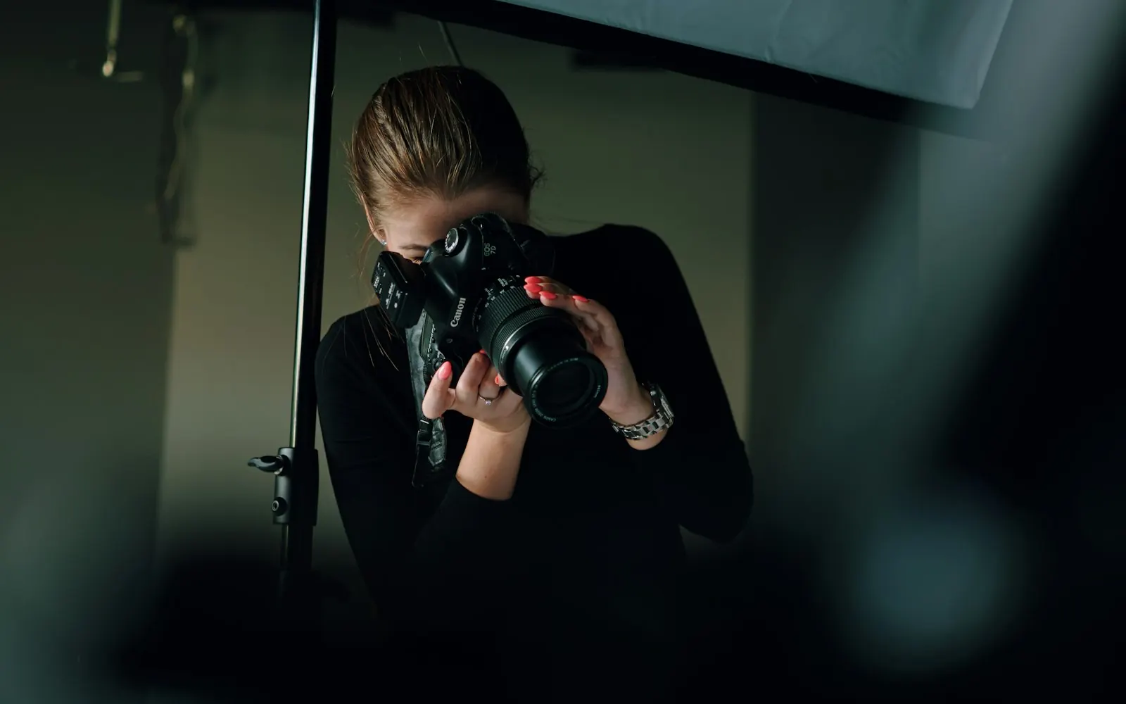 Woman photographer shooting with a camera during a content shoot for a Gold Coast business