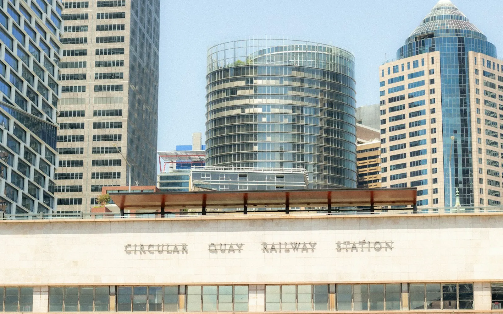 Circular Quay railway station in Sydney with office towers rising behind the platforms