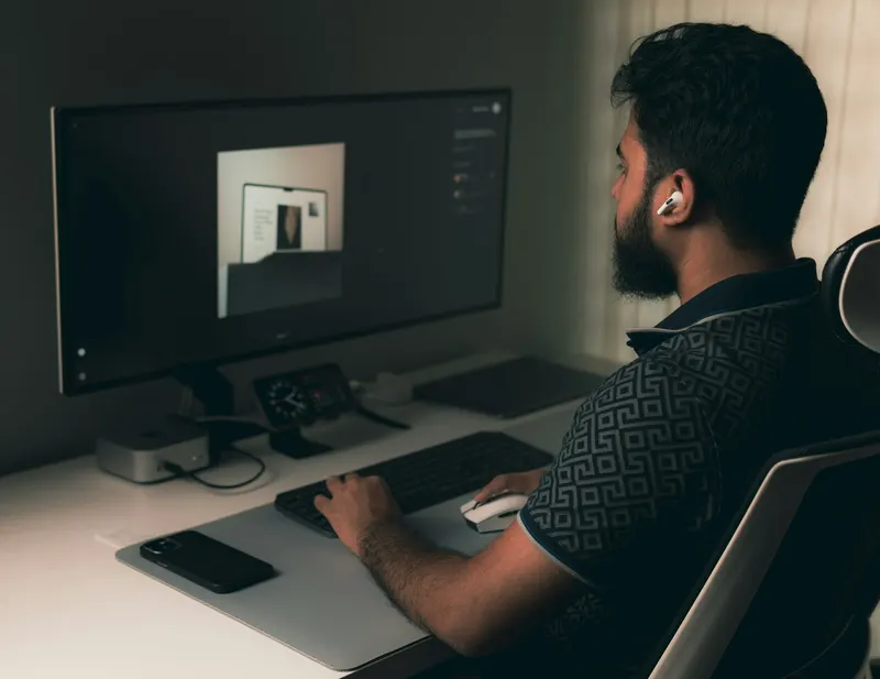 Developer building a website at a desktop computer