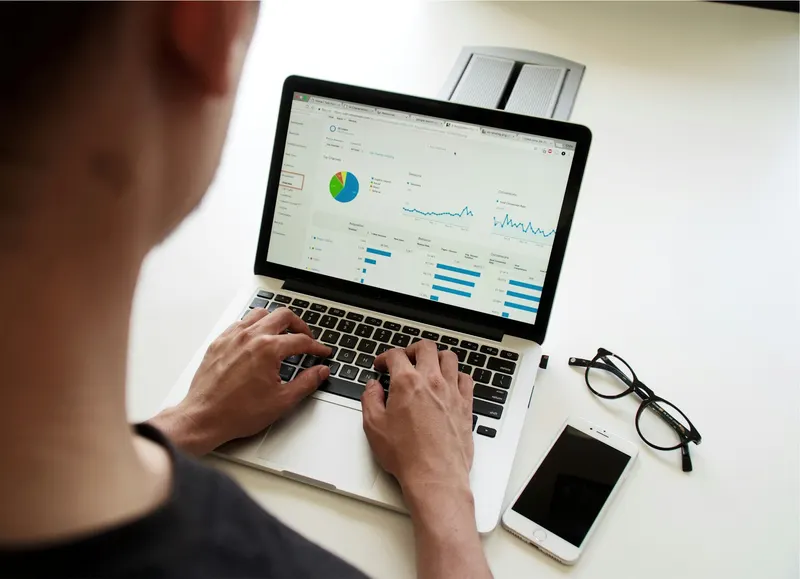 Marketer reviewing search analytics dashboards on a laptop