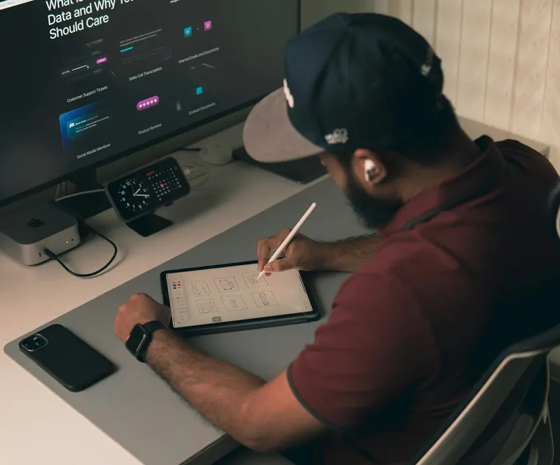 Designer working on a website layout at a desk