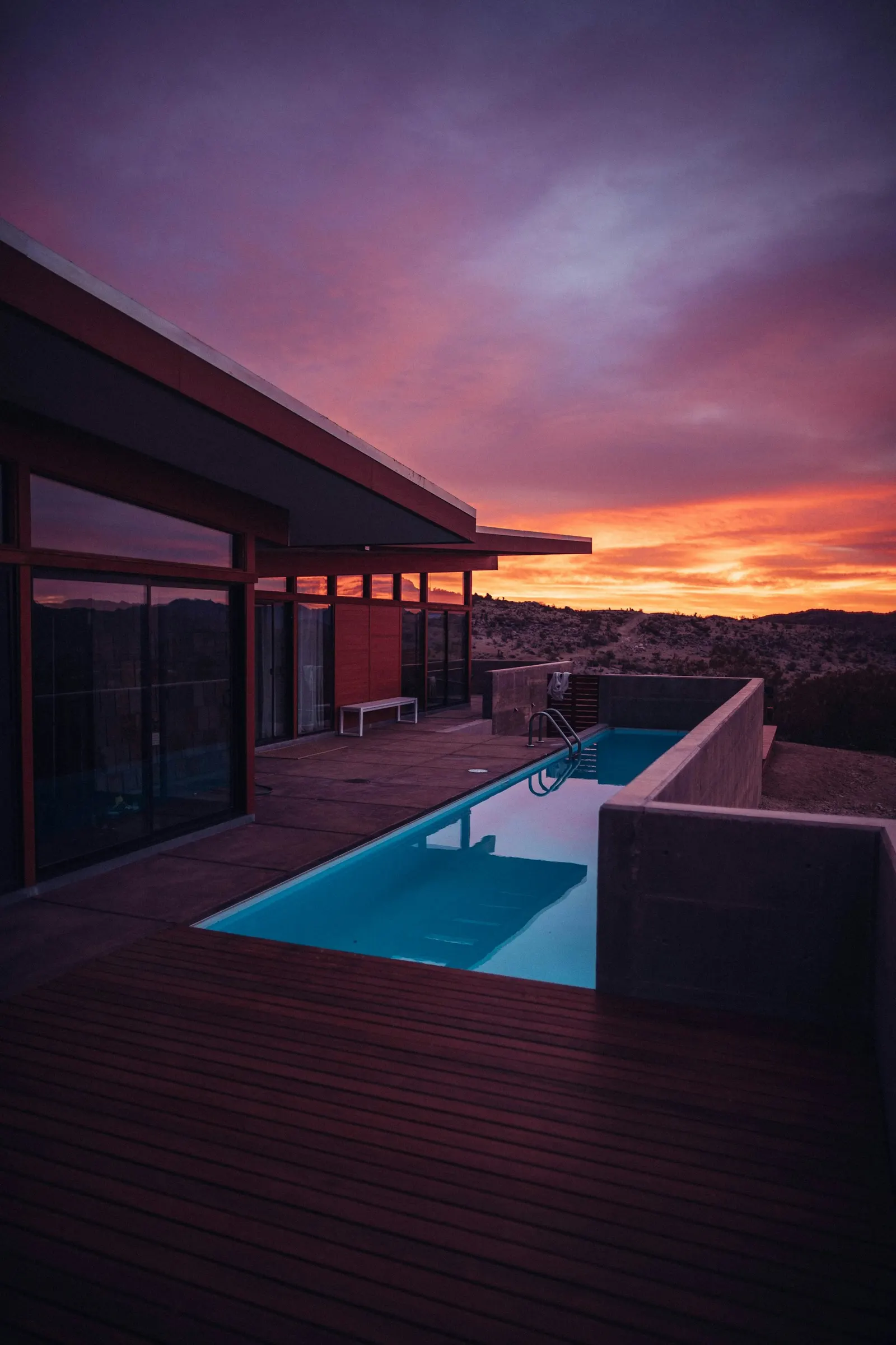 A private pool beside a desert house at golden hour